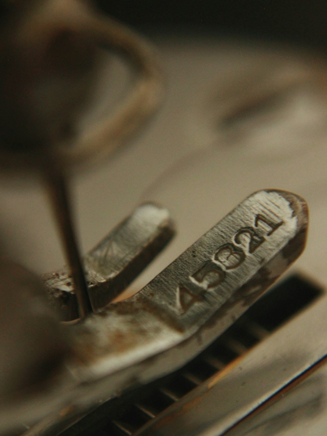 vintage-metal-machine-part-with-engraved-numbers-45821-ydfuonr4wi8